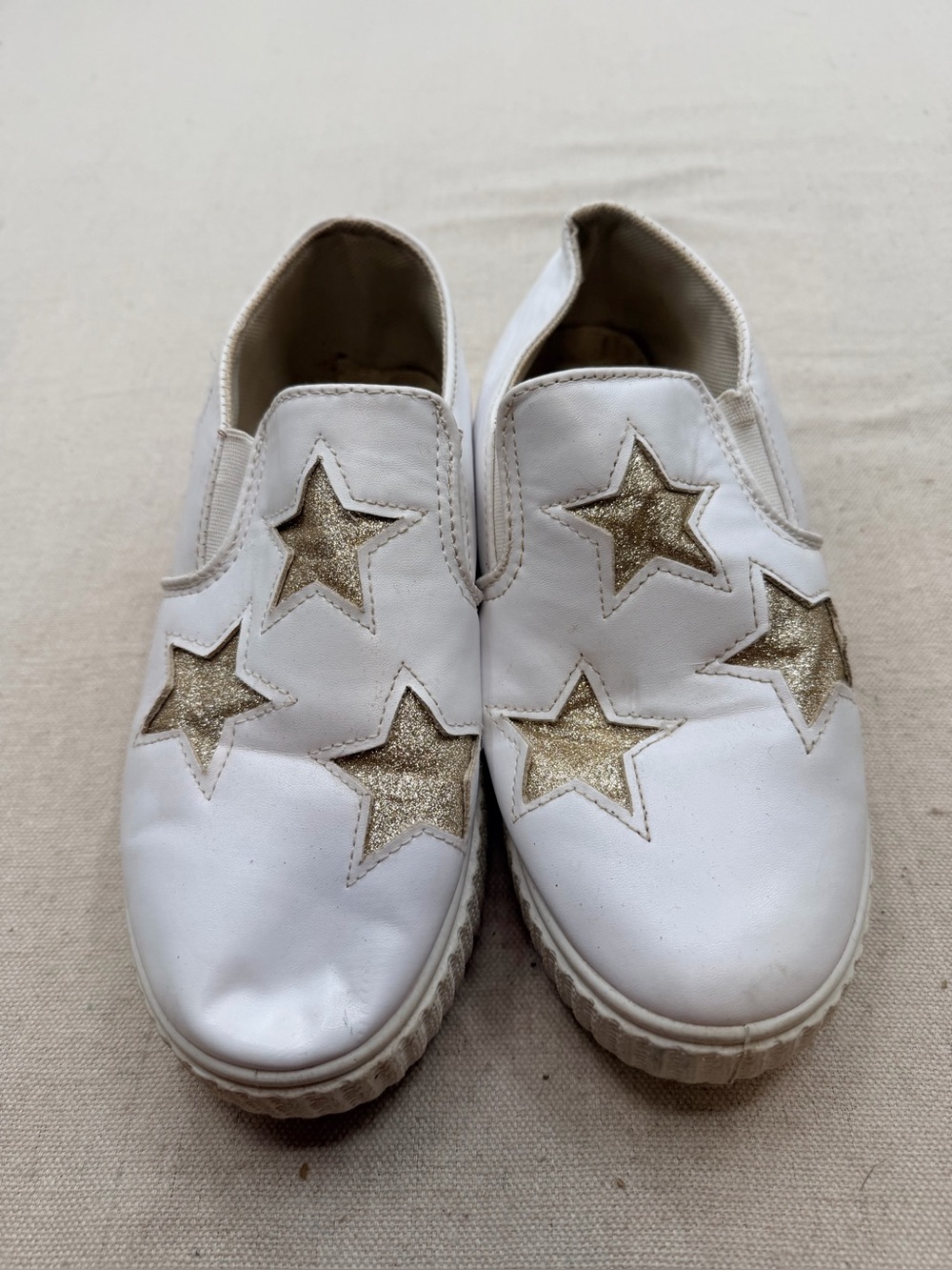 ' White Slip-On Sneakers with Gold Star Accents